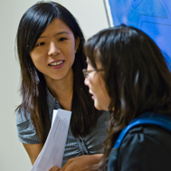 International students talking in a classroom